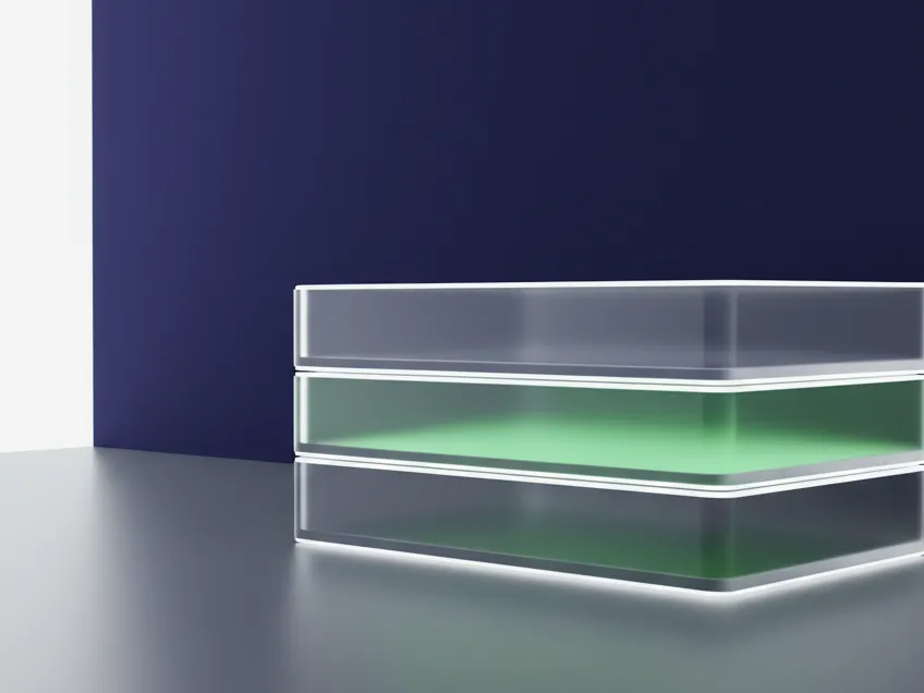 Stacked translucent containers on indigo, one lit green from inside.