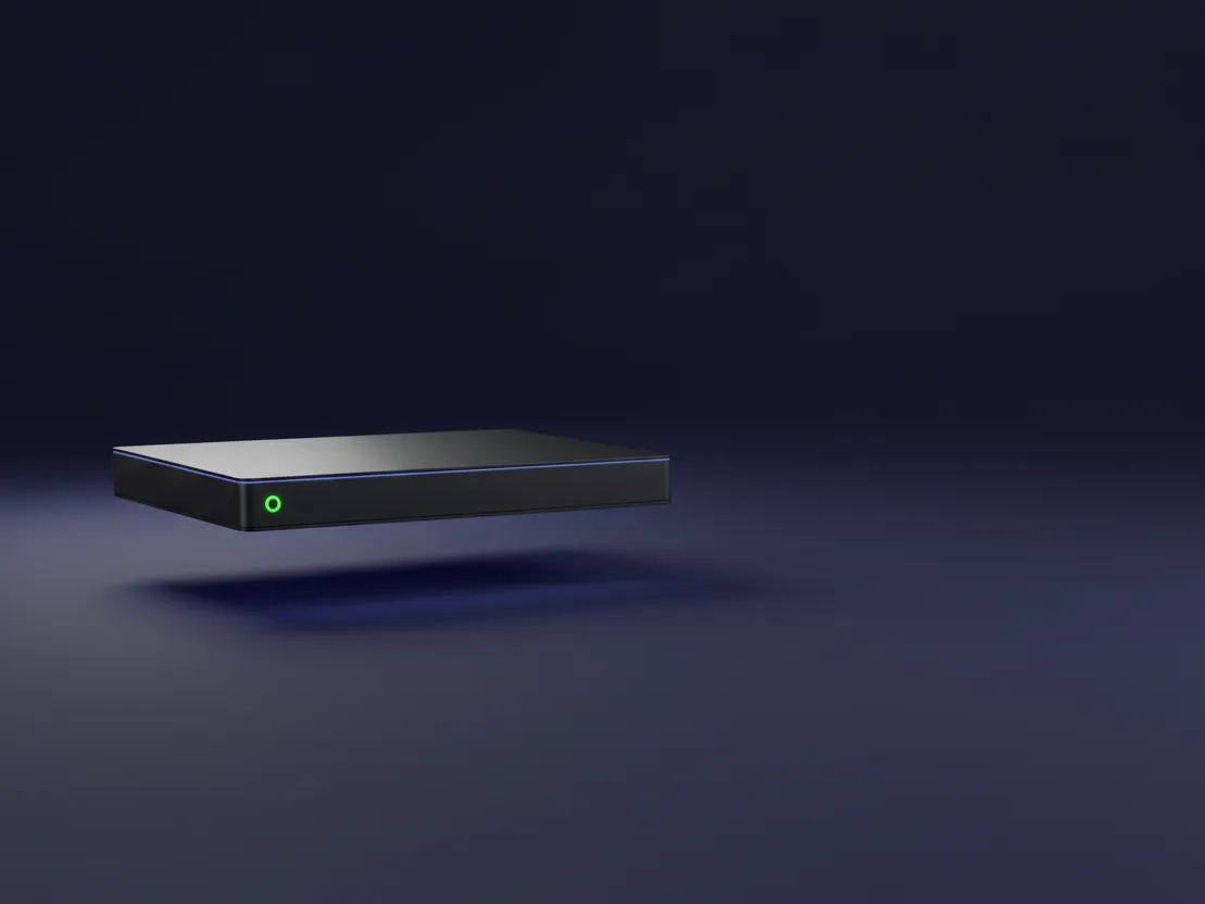 A single server drawn as a lit slab floating over deep indigo, one green light on its edge.